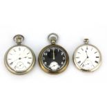 A military issue open face pocket watch, a L. M. S. railway pocket watch and a further open face