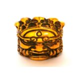 A Tibetan carved bone man's ring of a guardian deity wearing a skull crown, H. 2.5cm internal Dia.