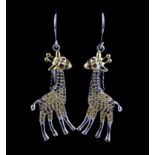 A matching pair of 925 silver giraffe shaped drop earrings set with sapphires and fancy yellow