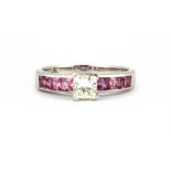 A platinum (stamped plat) ring set with a princess cut diamond and princess cut pink sapphire set