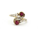 An 18ct yellow gold (stamped 18ct) ring set with rubies and old cut diamonds, (K).