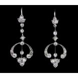 A pair of white metal (tested high carat gold) old cut diamond set drop earrings, L. 4cm