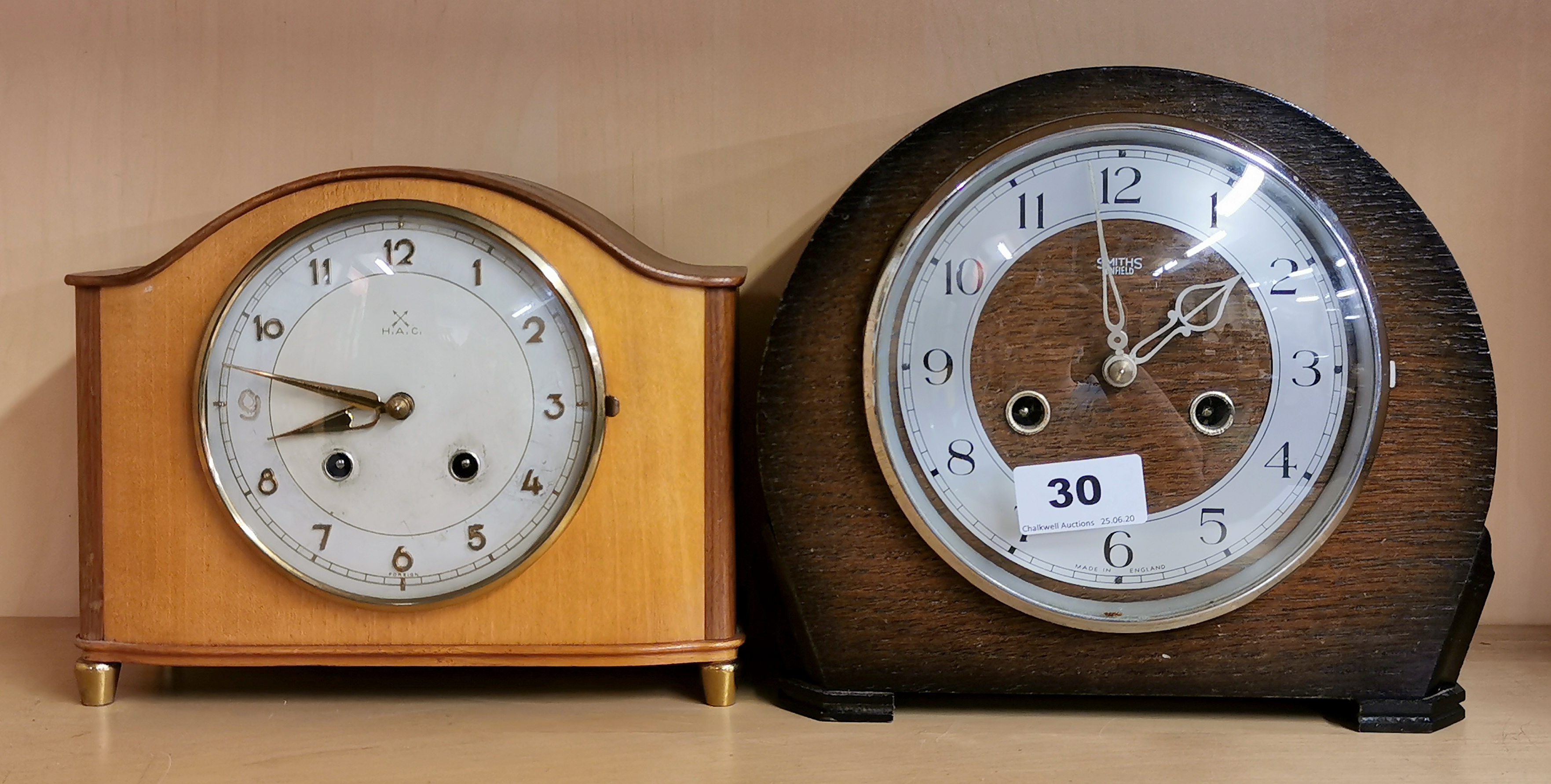 A Smiths Enfield oak cased striking mantle clock and a further mantle clock, H. 20cm.