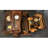 A quantity of Victorian and other wall clocks in various states of repair.