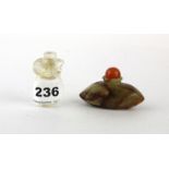 A Chinese carved rock crystal snuff bottle with crystal stopper and a carved hardstone snuff bottle,