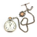 A hallmarked silver open face pocket watch with a silver and gold Albert chain and fob, Chester c.