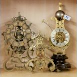 A 19th century granite based skeleton clock part movement, H. 40cm together with two further part