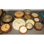 Two Bakelite electric wall clocks and ten further wall clocks.