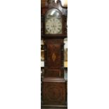 An early 19th century mahogany and oak inlaid longcased clock case with painted dial and striking