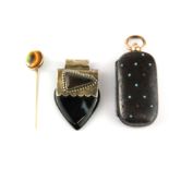 A 9ct stone set stick pin with a 925 silver and agate pendant and a gun metal sovereign case.