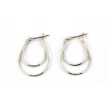 A pair of 9ct white gold hoop earrings, L. 2.2cm.