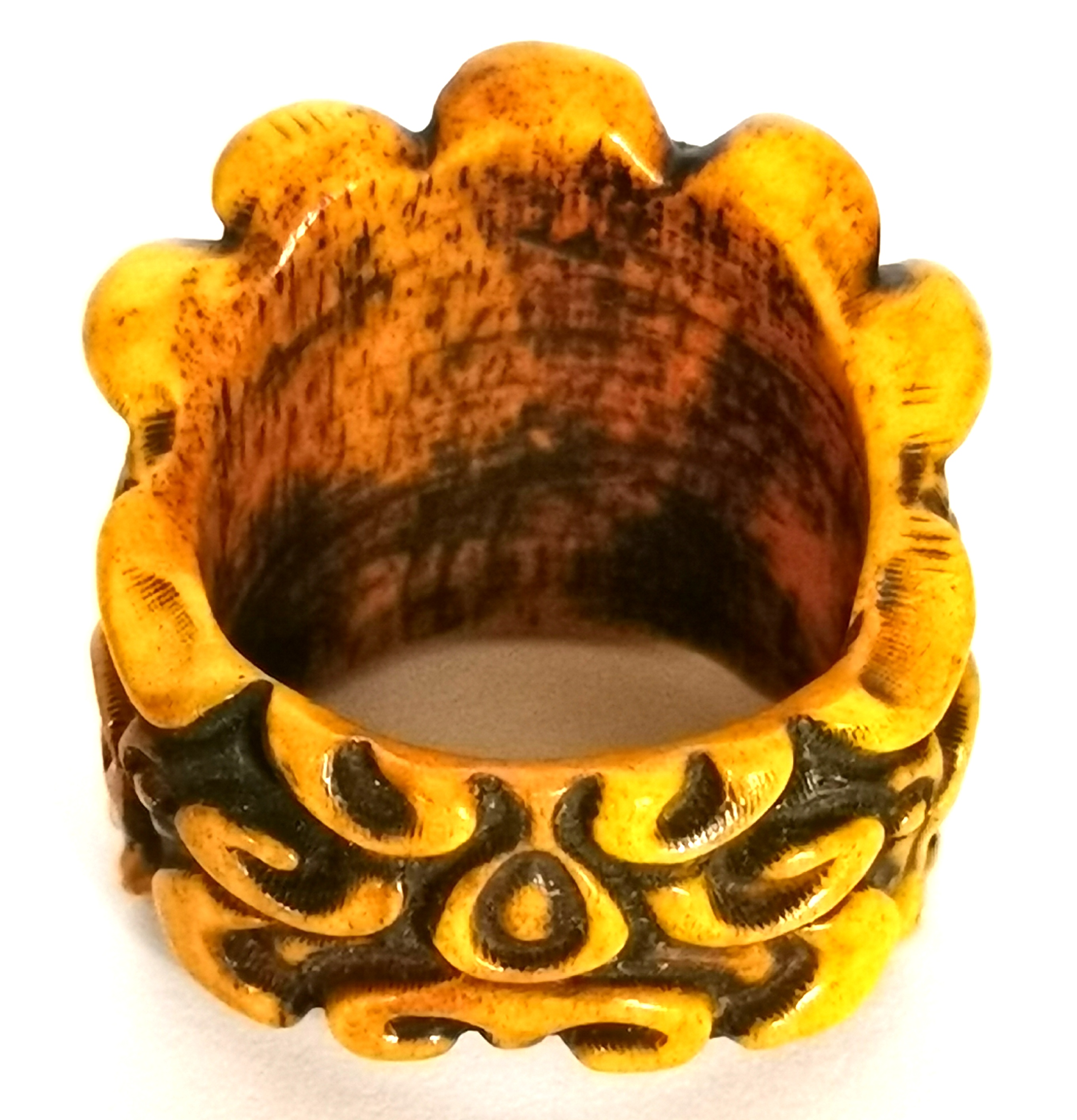 A Tibetan carved bone man's ring of a guardian deity wearing a skull crown, H. 2.5cm internal Dia. - Image 2 of 2