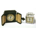 Two 1930's travelling alarm clocks H.8cm. Condition : working condition unknown.