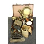 A vintage case of brass and other items.