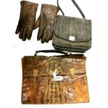 A vintage crocodile skin briefcase, together with a 1920's elephant hide bag and a pair of leather
