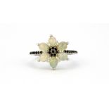 A 925 silver cluster ring set with cabochon cut opals and black spinels, (Q).