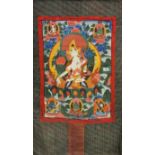 A Tibetan hand painted silk mounted Thangka of the White Tara, W. 83cm H. 120cm. Condition: good,
