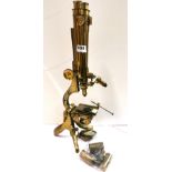 A large Victorian brass binocular microscope and a small quantity of related brass items, H. 47cm.
