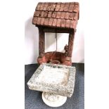 A vintage concrete garden wishing well, H. 82cm, together with a carved stone bird bath.