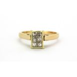 An 18ct yellow gold ring set with six princess cut diamonds, (N.5).