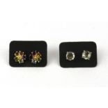 Two pairs of silver gilt semi precious stone set earrings.