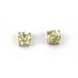 A pair of 18ct white gold (stamped 750) diamond set stud earrings, approx. 0.75ct overall.