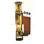 An unusual brass field pocket microscope, H. 13cm.