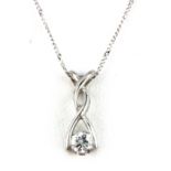 A 9ct white gold stone set pendant and chain, L. 1.5cm.