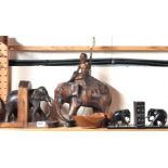 A 1930's plaster elephant table lamp, two pairs of elephant wooden bookends and a bowl.