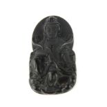 A lovely carved obsidian amulet of the goddess Guanyin, H. 6.5cm.