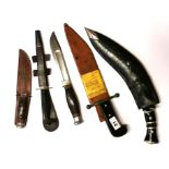 A group of four vintage daggers and a kukri, longest 42cm.