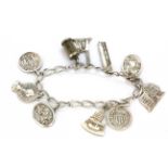 An American sterling silver charm bracelet, L. 17cm.