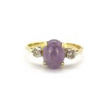 A 9ct yellow gold ring set with cabochon cut lavender jade and brilliant cut diamonds, (M).