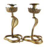 A pair of 19th / early 20th century Indian brass / bronze cobra candlesticks, H. 30cm. Condition: