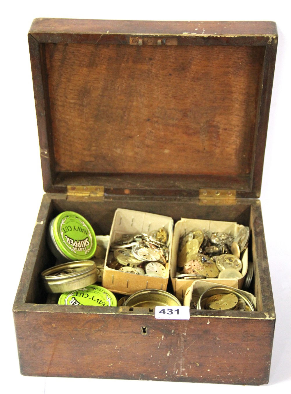 A box of mixed watch movements and parts.