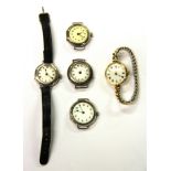 Three lady's vintage silver wrist watches and two others.