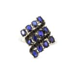 A 925 silver ring set with oval cut kyanite and black spinel, (Q).