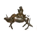 A 29th / early 20th century Chinese bronze censer of a boy riding a water buffalo, L. 20cm H. 16.