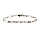 An 18ct white gold (stamped 750) diamond set line bracelet, approx. 1.24ct overall, L. 17cm.