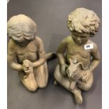 A pair of painted brass garden water feature figures of children, H. 36cm.