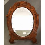 An unusual William IV walnut veneered free standing mirror with scalloped edged glass, H. 54cm.