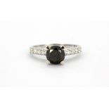 A Tresor Paris 18ct white gold (stamped 750) solitaire ring set with a brilliant cut fancy black