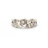 A 9ct white gold diamond set hearts ring, (N.5).