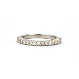 An 18ct white gold diamond set full eternity ring, (M.5).