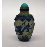 A Chinese two layer Peking carved cameo glass snuff bottle with gilt and hardstone stopper, H.