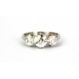 A 950 platinum ring set with three old brilliant cut diamonds, approx. 1.08ct centre diamond, 2.16
