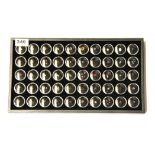 A tray containing over 50 individually boxed unmounted gemstones including diamonds, rubies,
