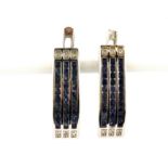 A pair of 925 silver earrings set with three rows of round cut sapphires, L. 2.1cm.