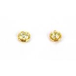 A pair of 18ct yellow gold diamond set stud earrings.