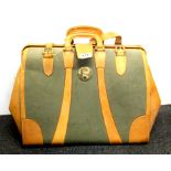 A vintage canvas and leather bag, W. 56cm.